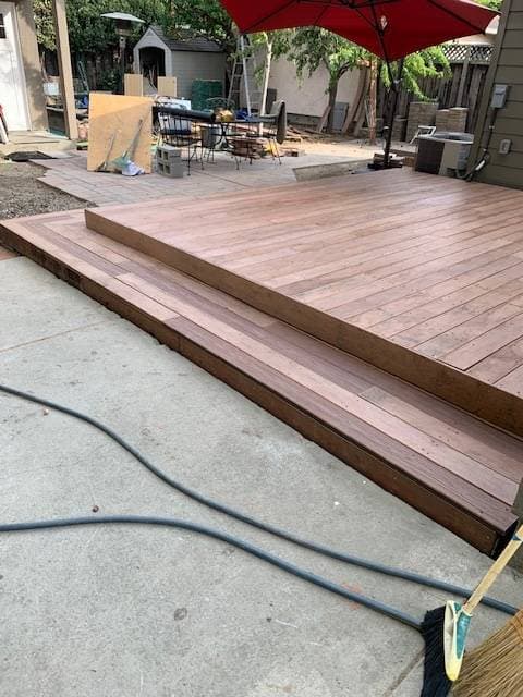 picture of a newly installed and stained  layered deck